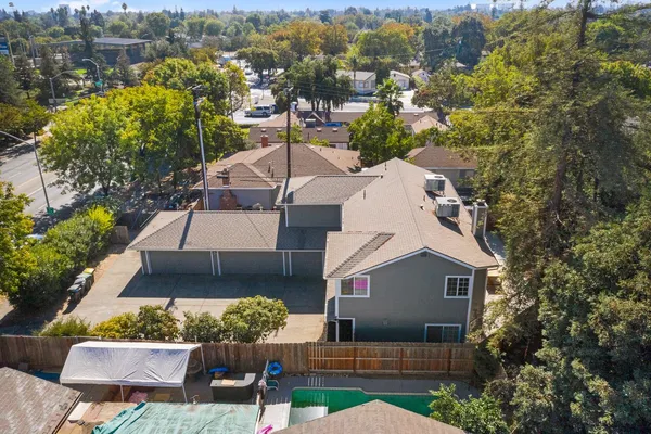 a aerial view of a house with a yard