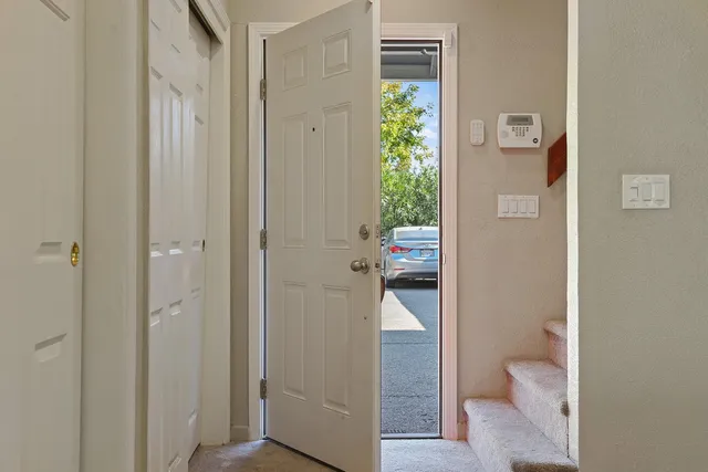 a bedroom with two beds and a couch