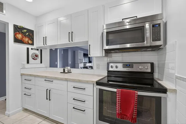 a view of a glass door with a yard from a window