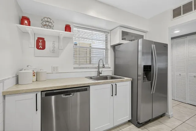 a bathroom with a sink toilet vanity and vanity