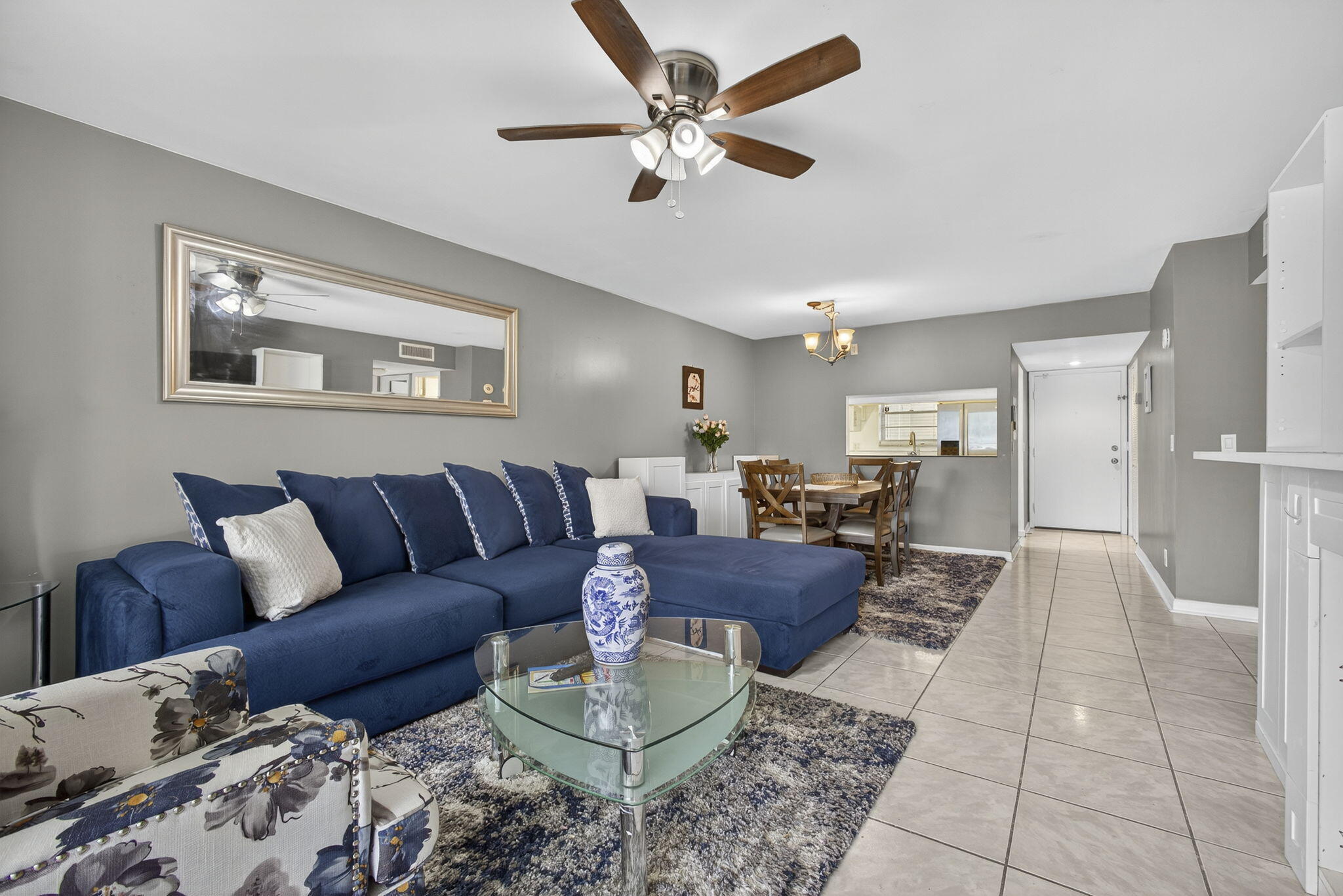 12001 Poinciana Boulevard, Unit 204 Royal Palm Beach, FL 33411 - Photo 21 of 42 a living room with furniture and a view of kitchen