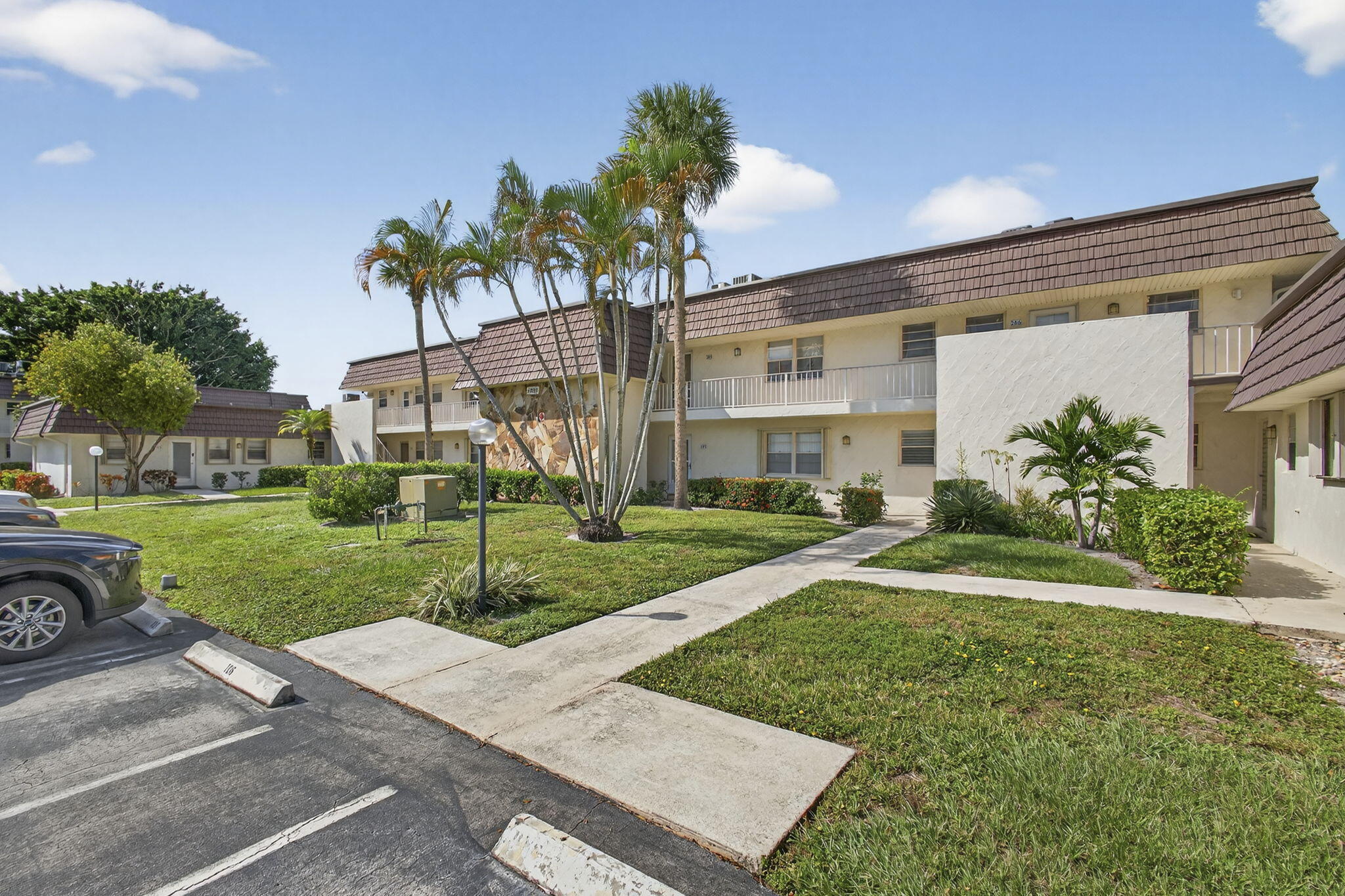12001 Poinciana Boulevard, Unit 204 Royal Palm Beach, FL 33411 - Photo 3 of 42 FRONT VIEW
