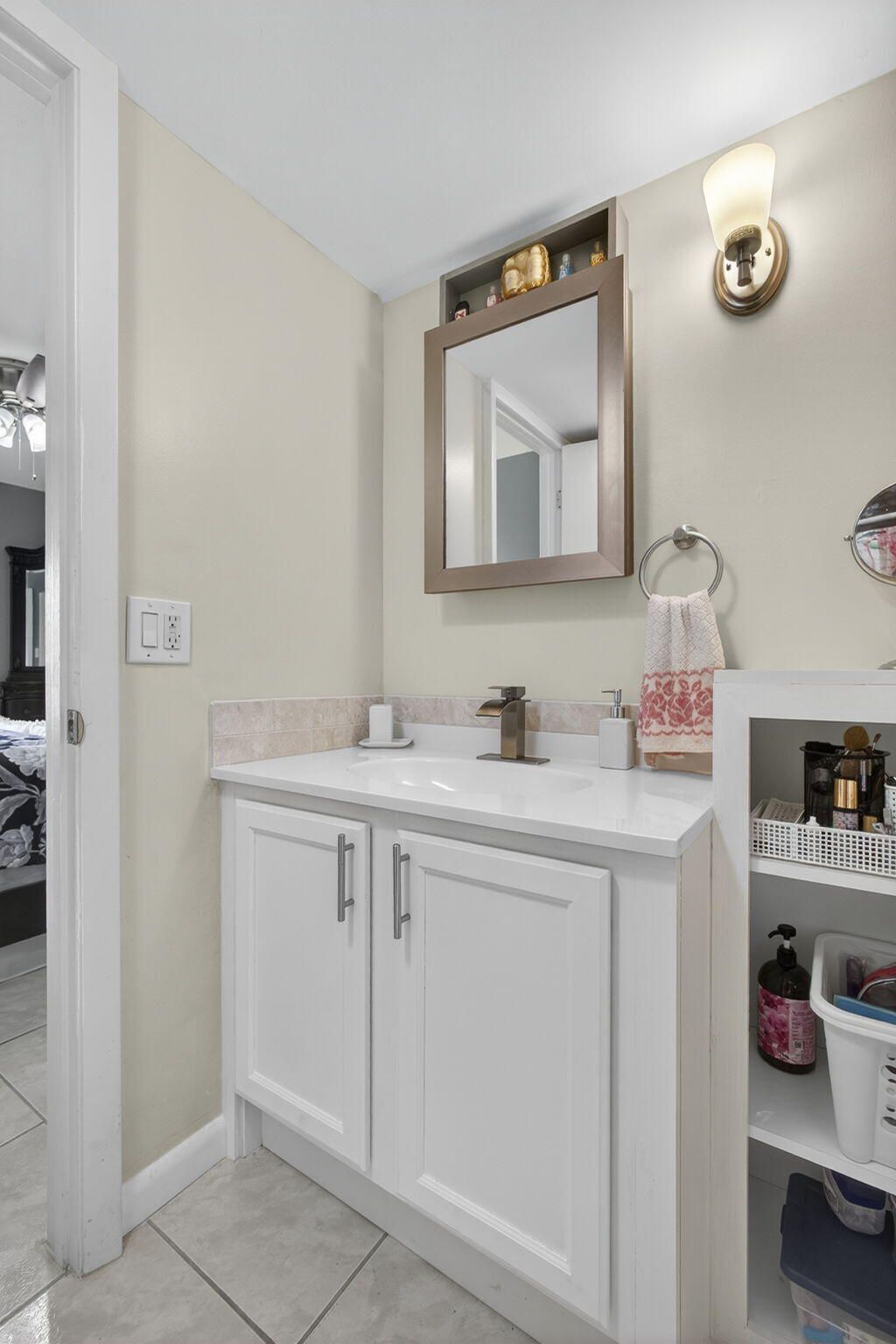 12001 Poinciana Boulevard, Unit 204 Royal Palm Beach, FL 33411 - Photo 36 of 42 a bathroom with a sink vanity and a mirror