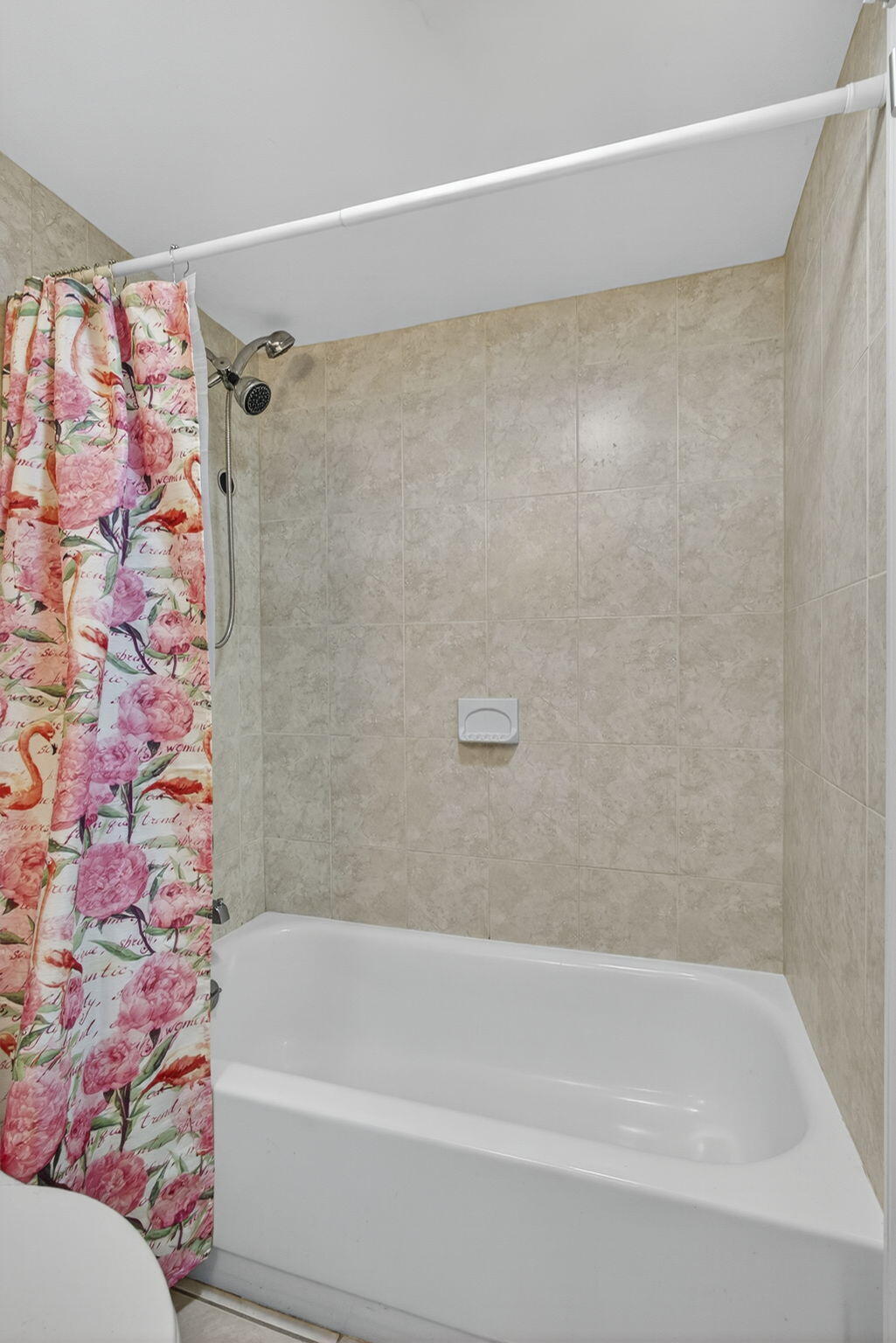 12001 Poinciana Boulevard, Unit 204 Royal Palm Beach, FL 33411 - Photo 37 of 42 a bathroom with a shower and a bath tub