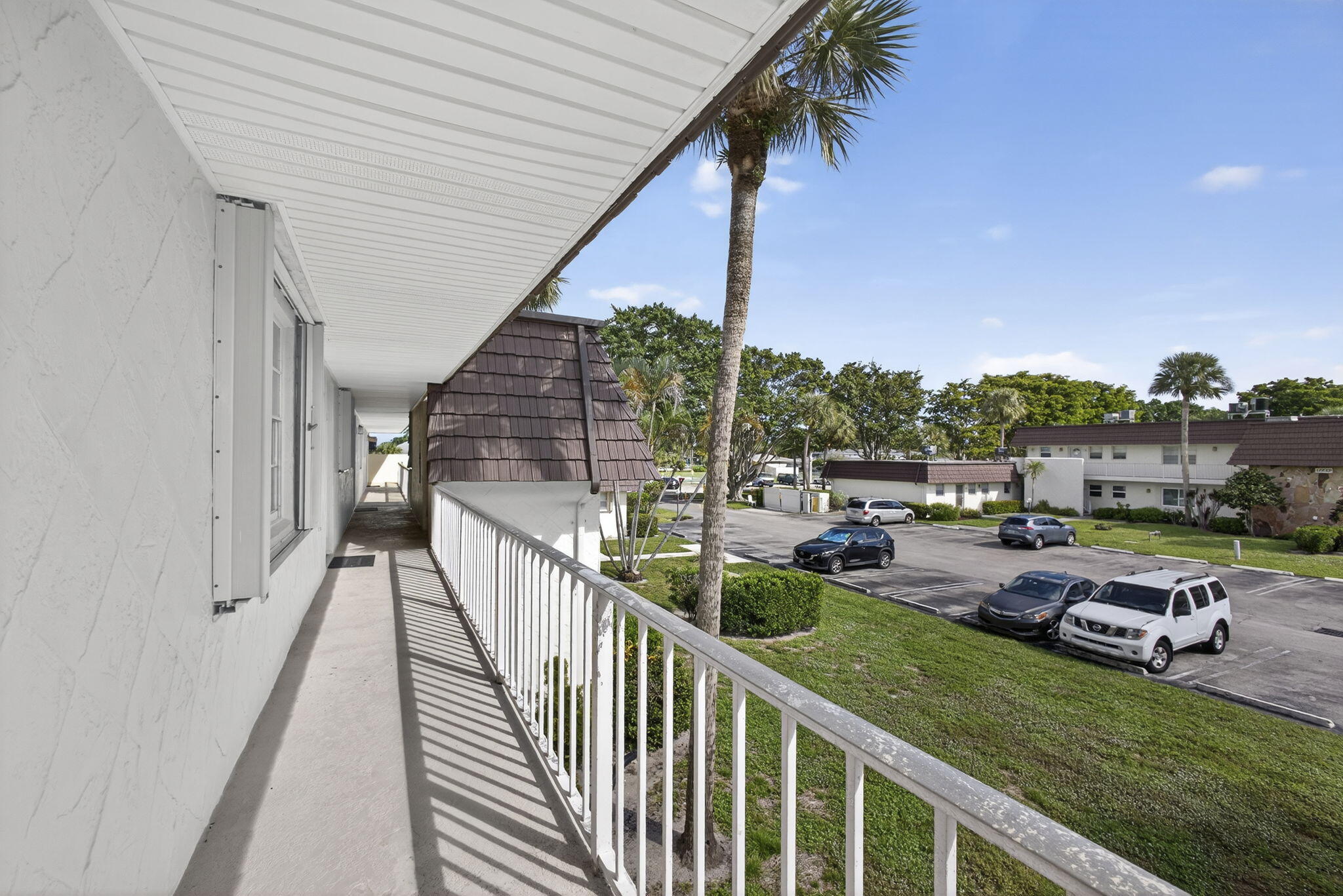 12001 Poinciana Boulevard, Unit 204 Royal Palm Beach, FL 33411 - Photo 7 of 42 Walkway