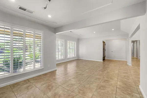 a view of an empty room with a window