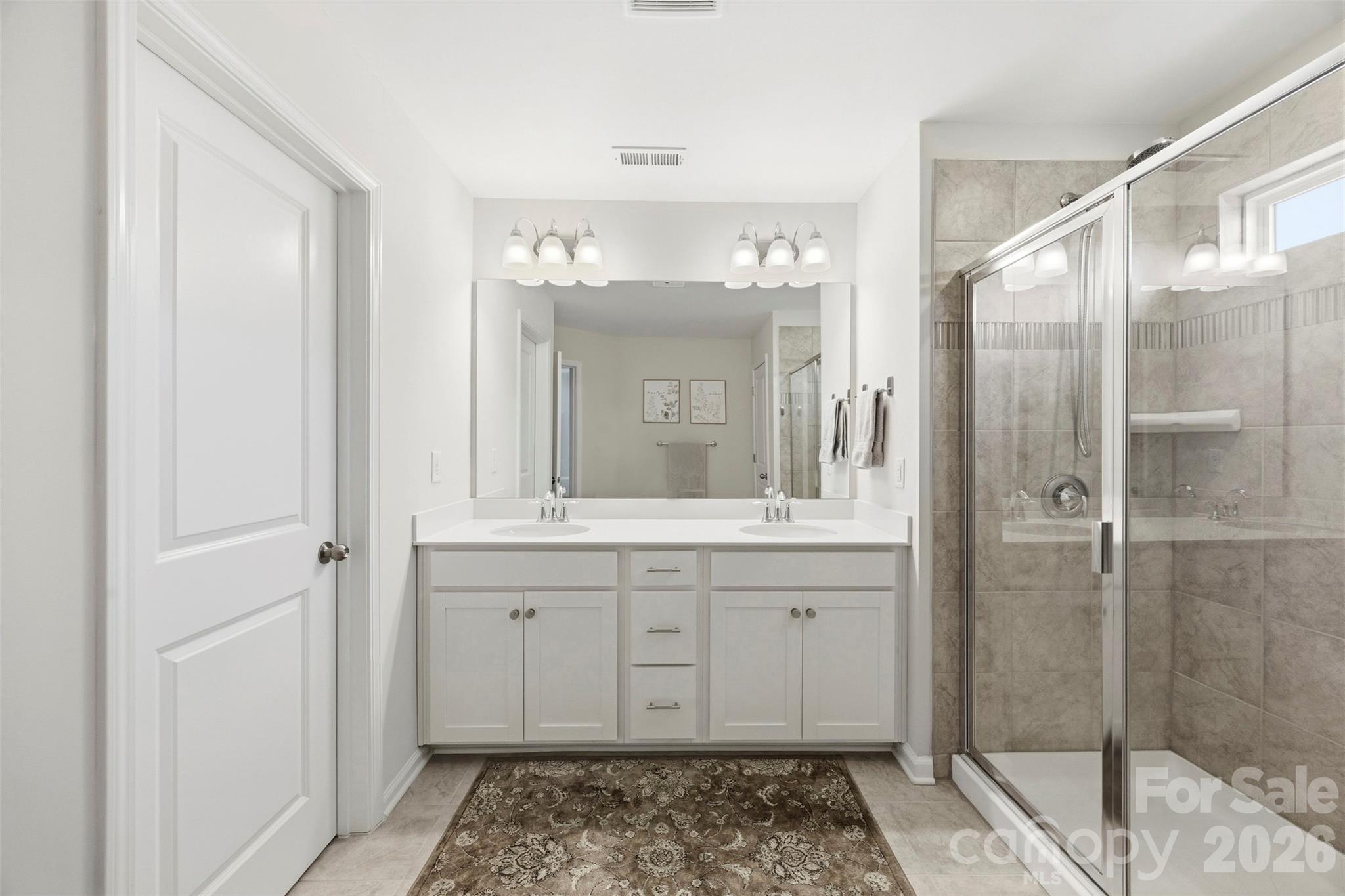 5030 Moss Pne Way Fort Mill, SC 29708 - Photo 17 of 28 a bathroom with a double vanity sink mirror and shower
