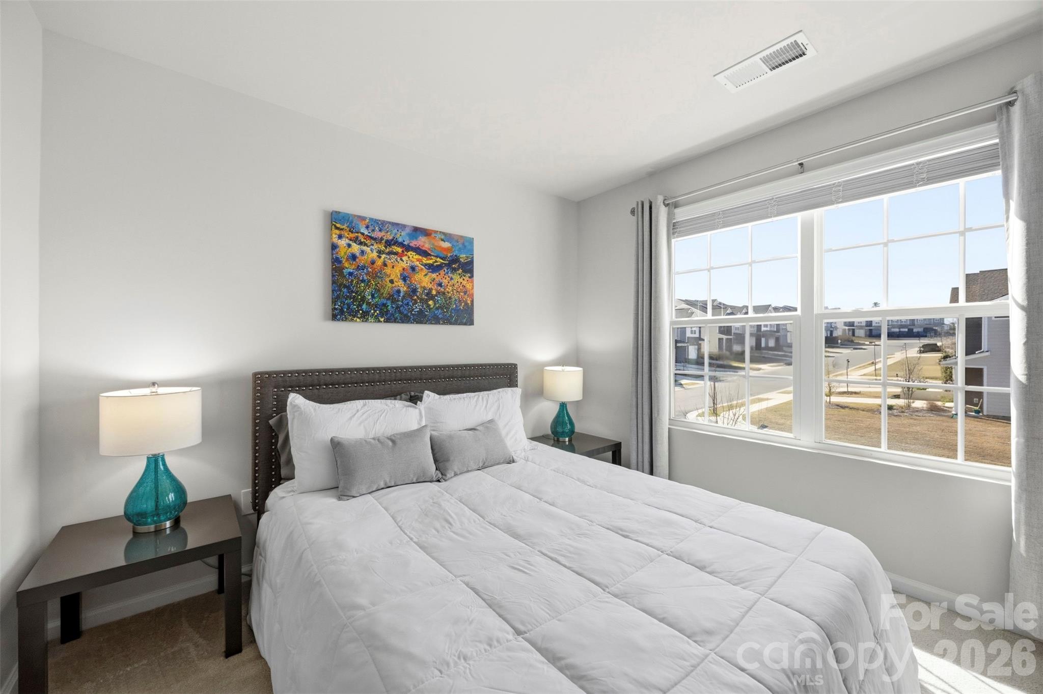 5030 Moss Pne Way Fort Mill, SC 29708 - Photo 21 of 28 a bedroom with a large bed and a large window