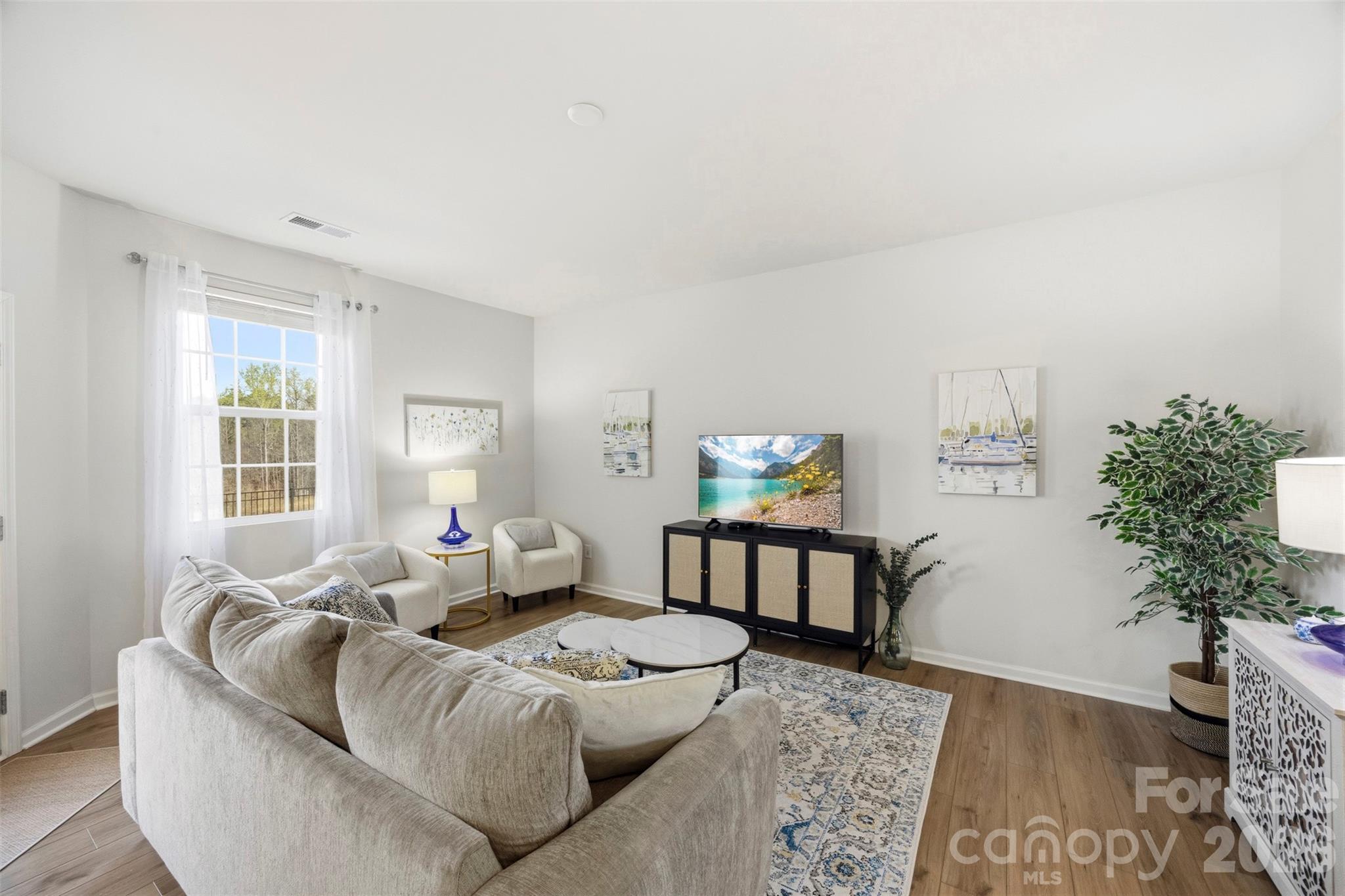 5030 Moss Pne Way Fort Mill, SC 29708 - Photo 4 of 28 a living room with furniture and a potted plant