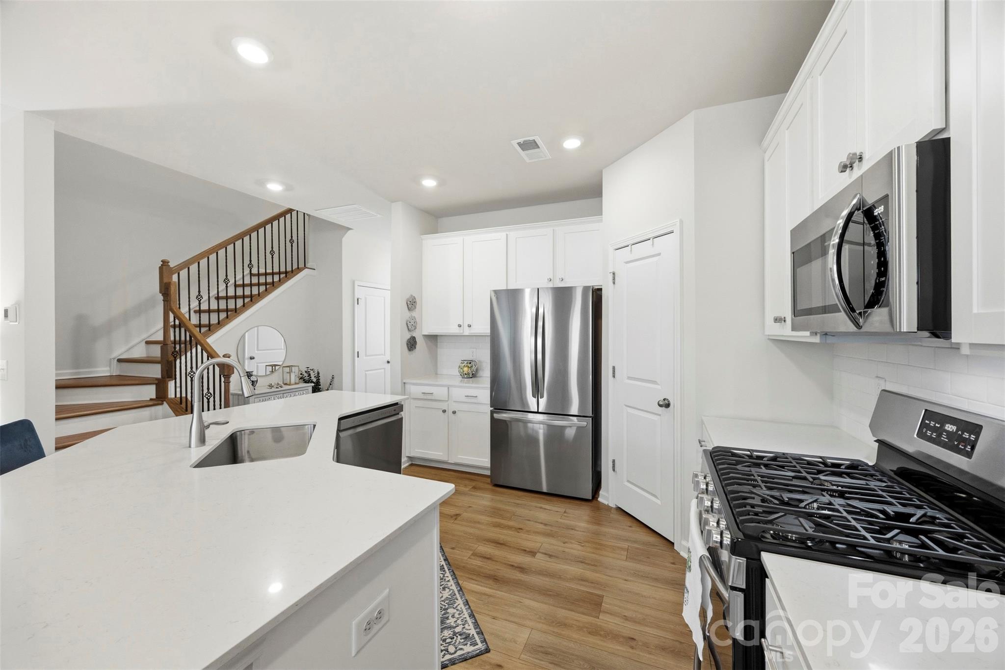 5030 Moss Pne Way Fort Mill, SC 29708 - Photo 9 of 28 a kitchen with refrigerator and stove