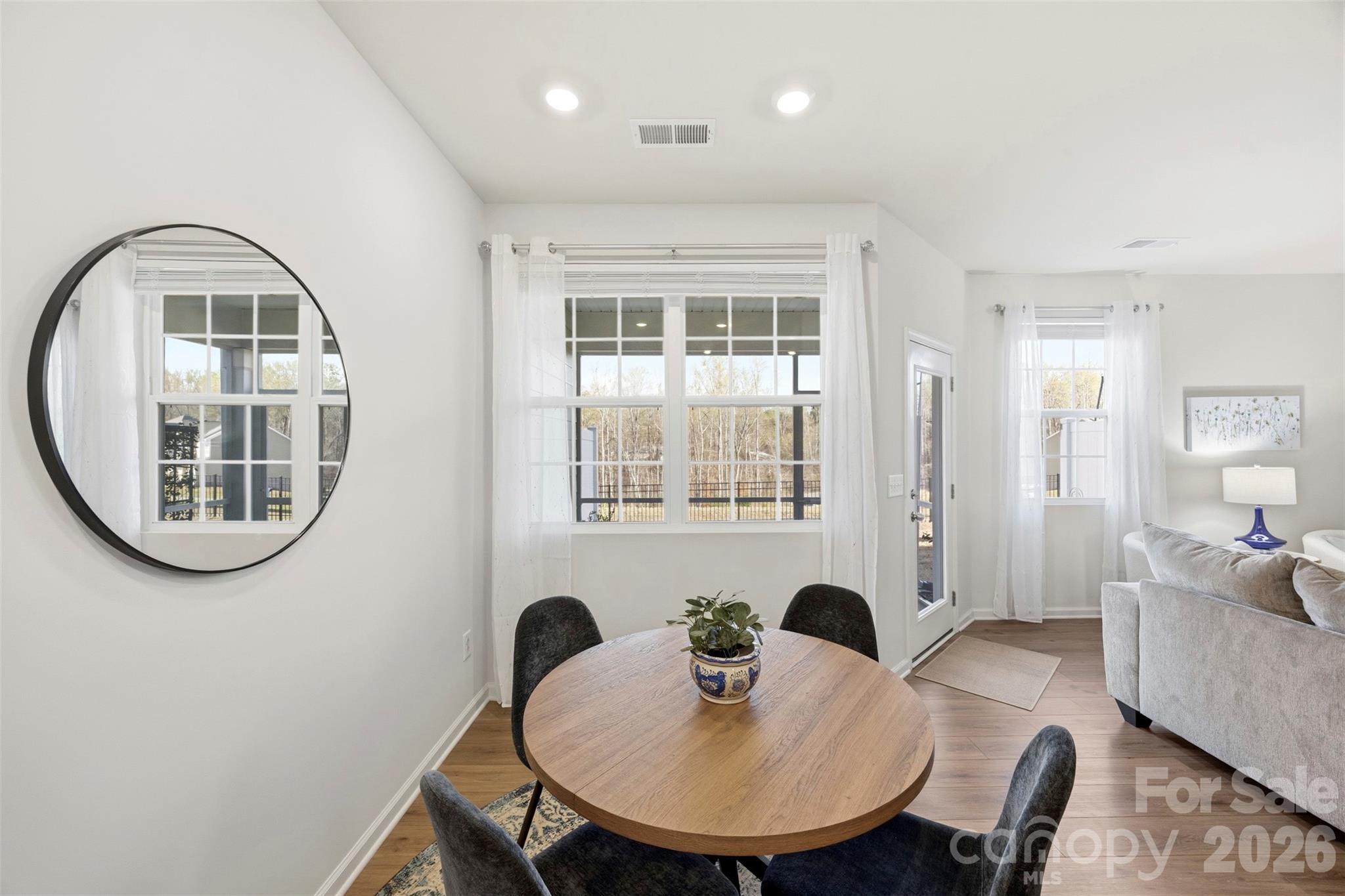 5030 Moss Pne Way Fort Mill, SC 29708 - Photo 10 of 28 a view of a dining room with furniture and a mirror