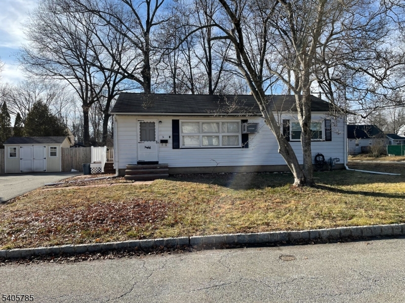 31 Kingston Road Parsippany, NJ 07054 - Photo 1 of 15 front view of a house with a yard