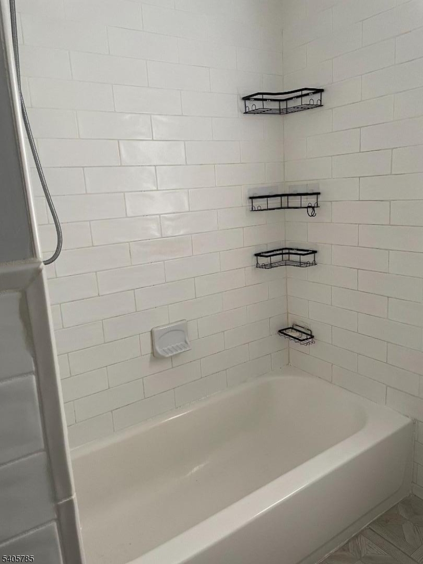 31 Kingston Road Parsippany, NJ 07054 - Photo 11 of 15 a bathroom with a bathtub