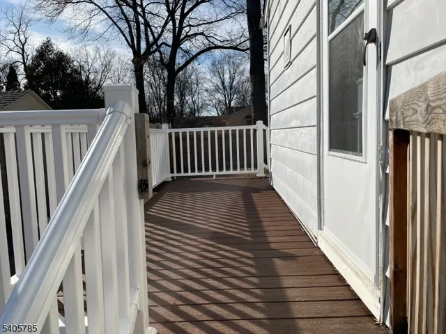 a balcony with wooden floor