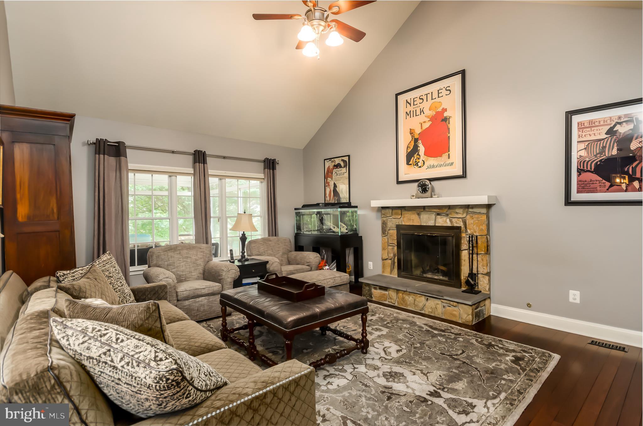 1330 Murray Downs Way Reston, VA 20194 - Photo 14 of 38 a living room with furniture and a fireplace