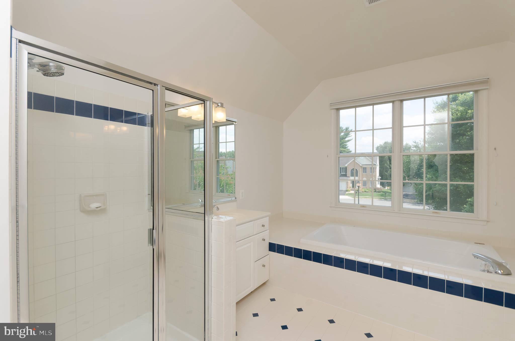 1330 Murray Downs Way Reston, VA 20194 - Photo 22 of 38 a bathroom with a bathtub and a shower