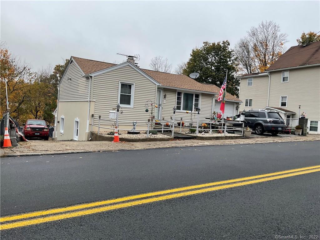 a view of street with parked cars