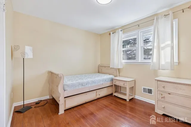 a bedroom with a bed and a table