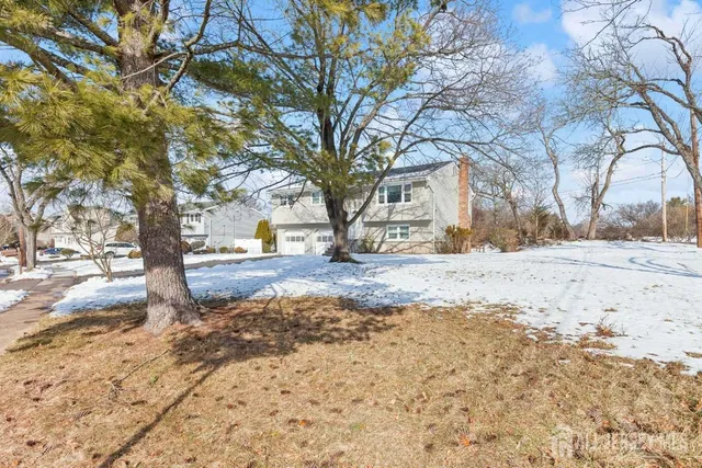 a view of road with snow on the road