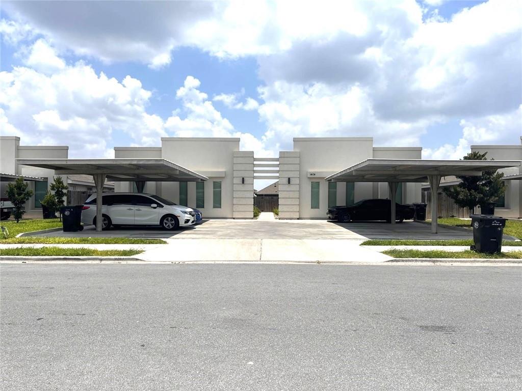 Modern home with covered parking and stucco siding