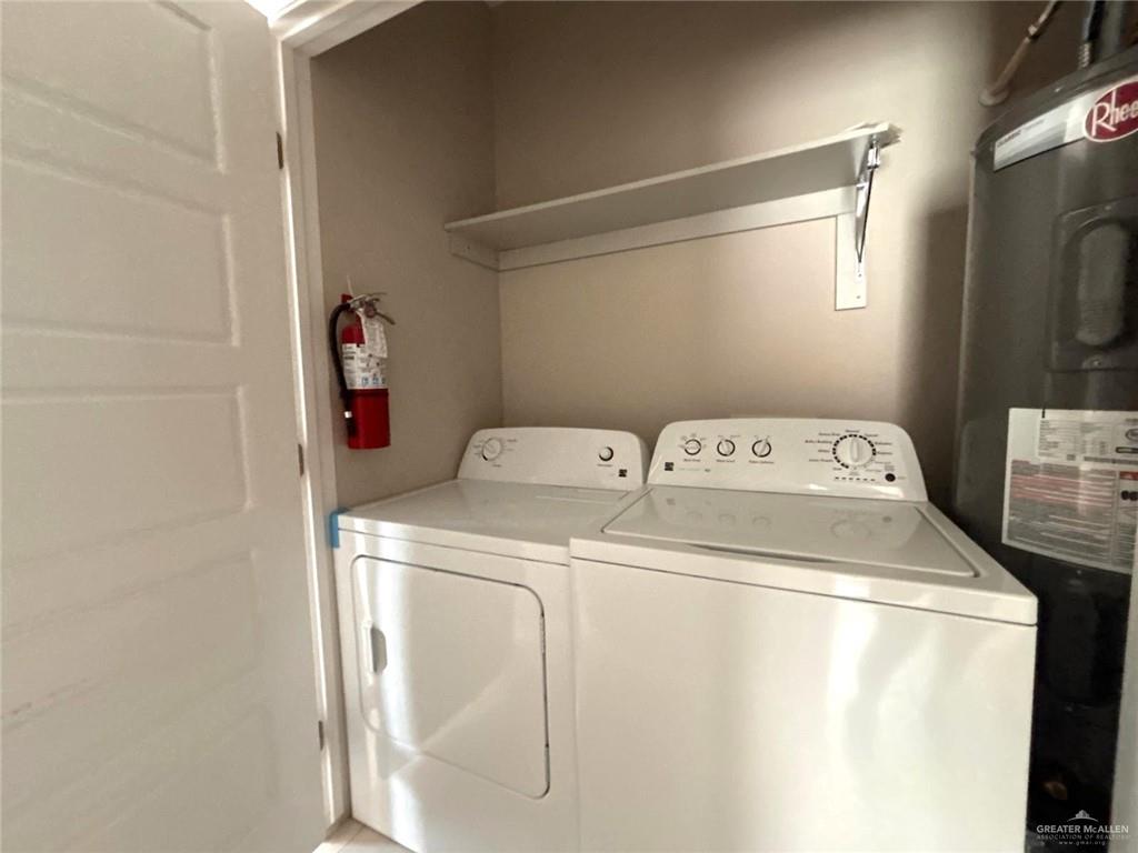 1405 Alta Vista Drive, Unit 4 Weslaco, TX 78596 - Photo 13 of 15 Washroom featuring washing machine and clothes dryer and electric water heater