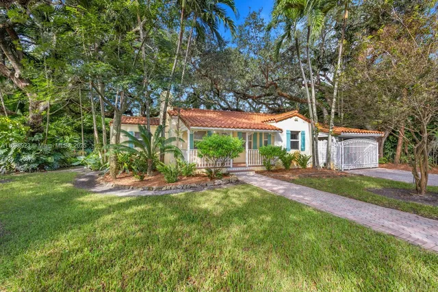 a front view of a house with garden