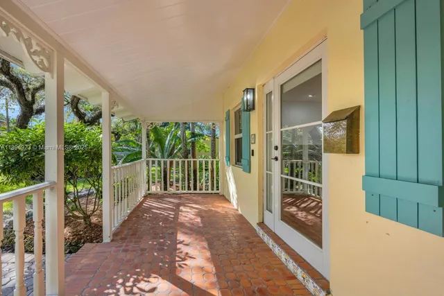 a view of a porch with a floor to ceiling window