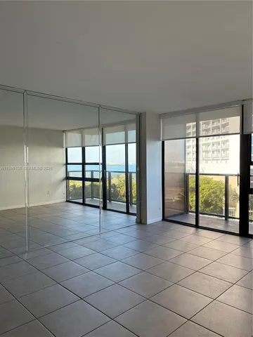 a view of an empty room and window