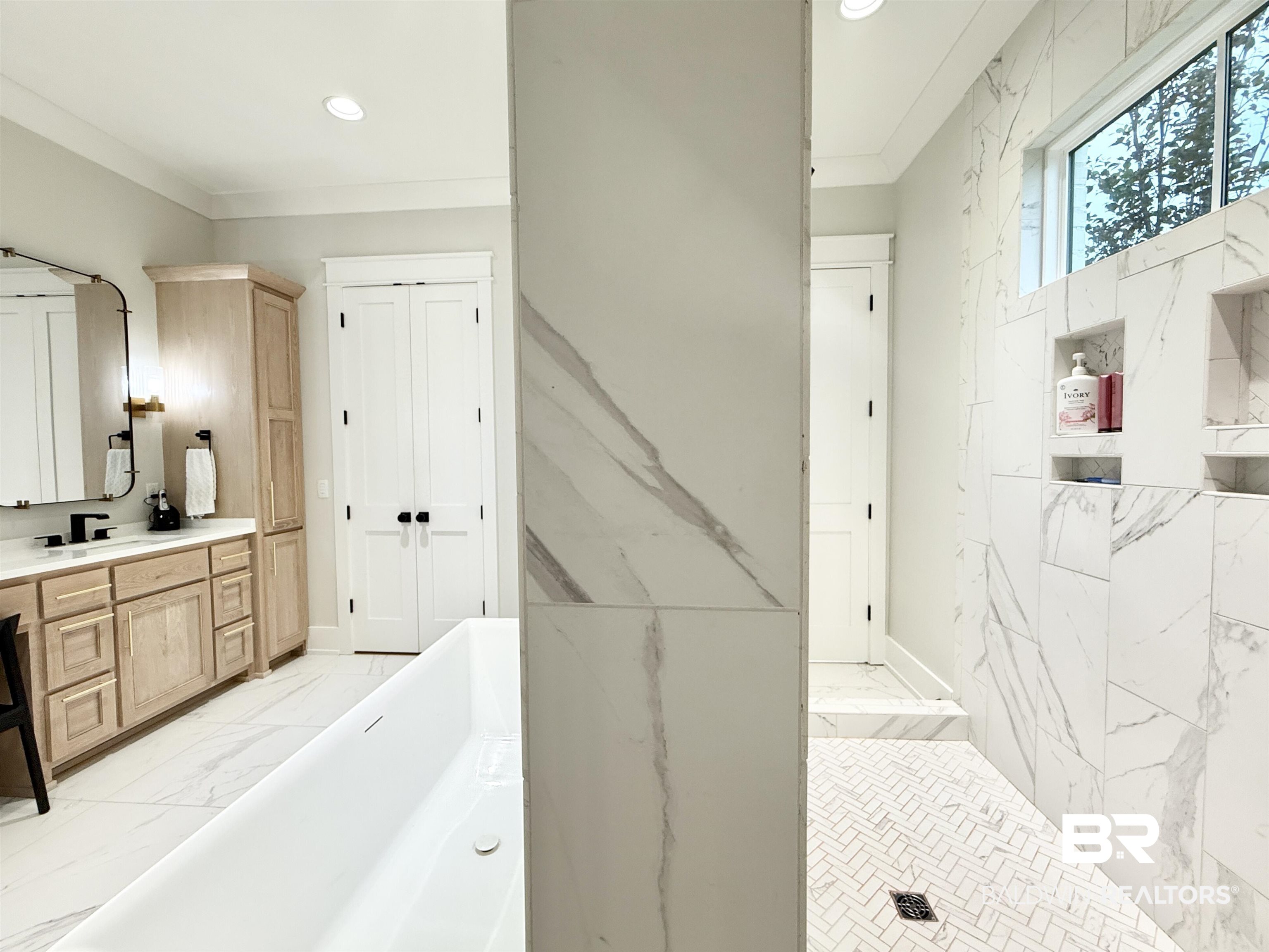 21767 Gallery Boulevard Fairhope, AL 36532 - Photo 33 of 74 Full bath featuring marble finish floors, a soaking tub, vanity, ornamental molding, and recessed lighting