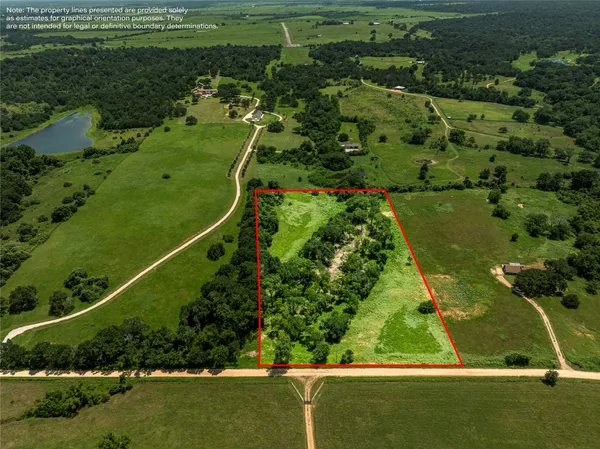 an aerial view of a golf course with a lake view