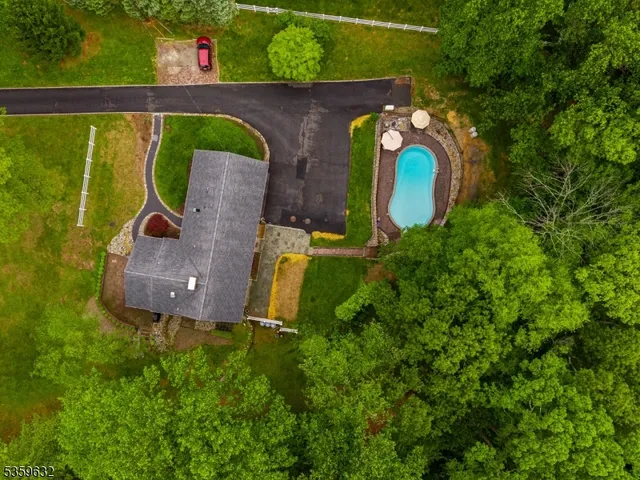 an aerial view of a house with outdoor space sitting space