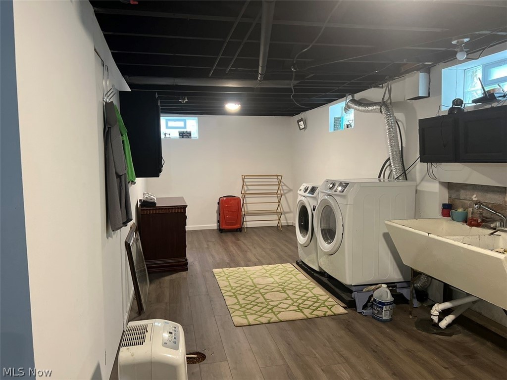 759 Truesdale Road Youngstown, OH 44511 - Photo 23 of 37 Laundry area featuring washing machine and dryer, dark hardwood / wood-style floors