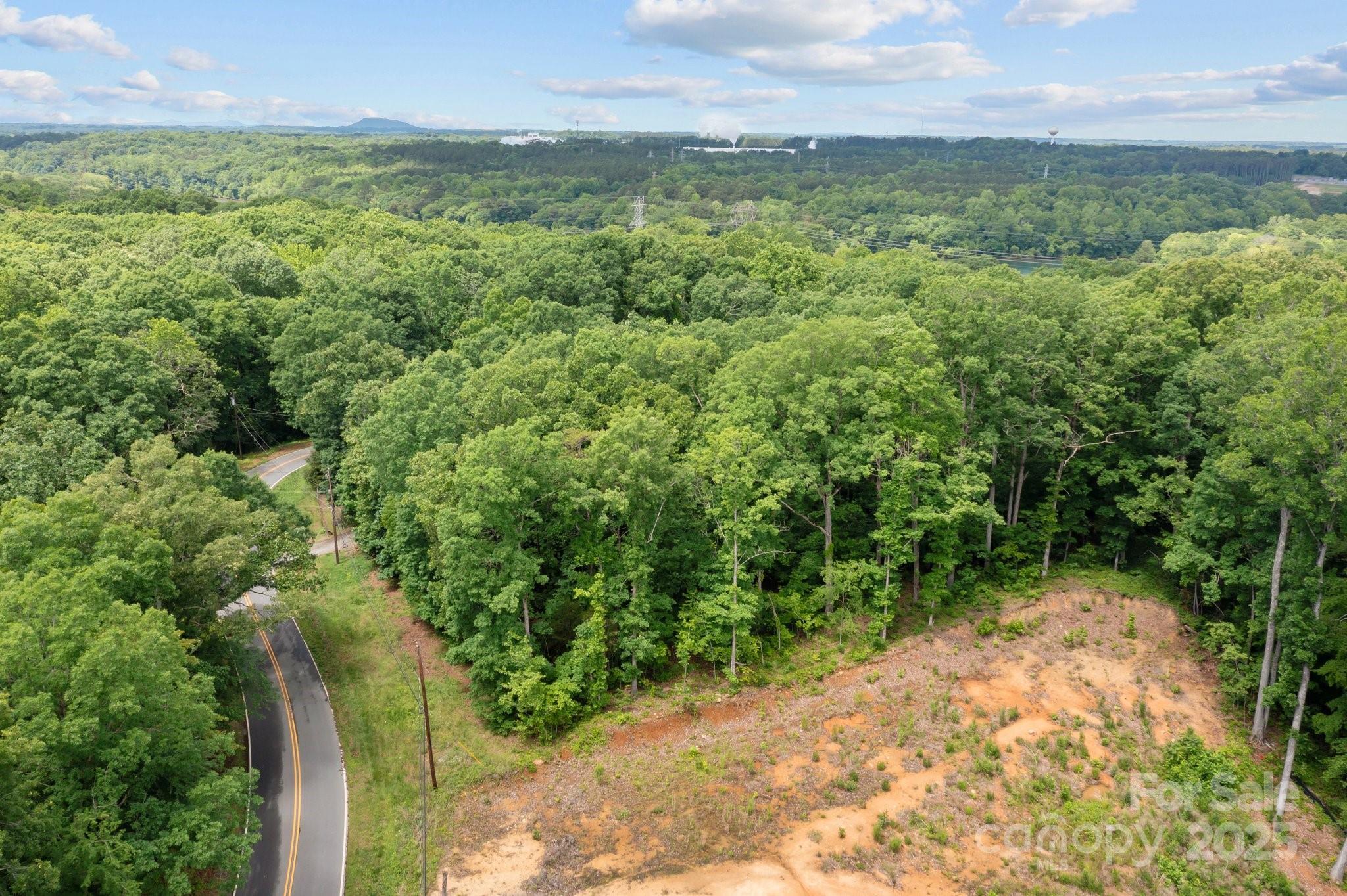 1607 Hart Road Charlotte, NC 28214 - Photo 13 of 14 a view of a lush green outdoor space with a lake view and mountain view
