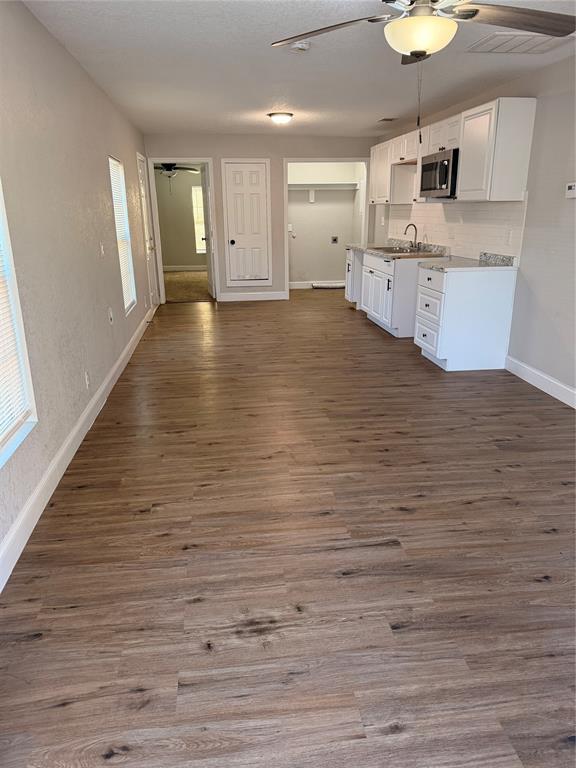 3522 Roberts Avenue Dallas, TX 75215 - Photo 3 of 7 a large kitchen with stainless steel appliances granite countertop a granite counter tops and a wooden floors