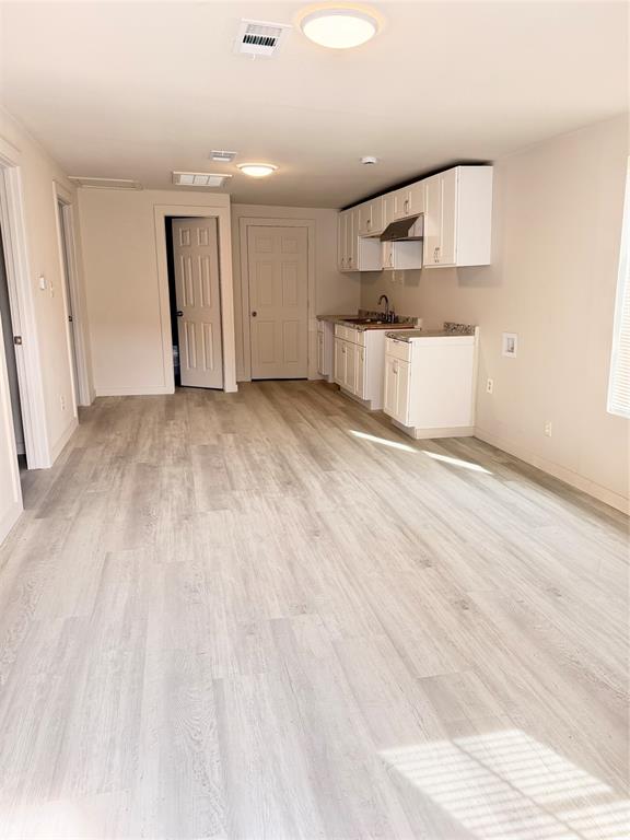 3522 Roberts Avenue Dallas, TX 75215 - Photo 6 of 7 a view of a kitchen with a sink and a refrigerator
