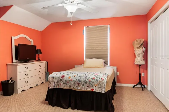 a bedroom with furniture and flat screen tv