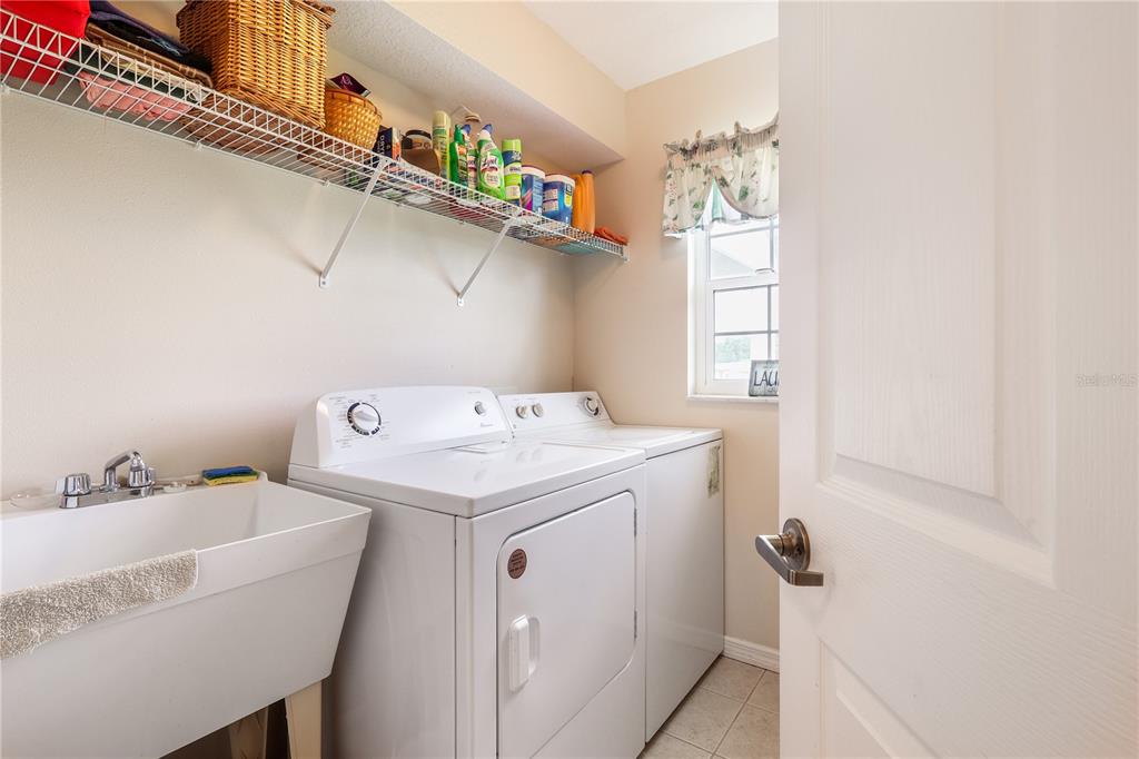 7290 Northeast 106 Terrace Bronson, FL 32621 - Photo 26 of 40 a utility room with dryer and washer