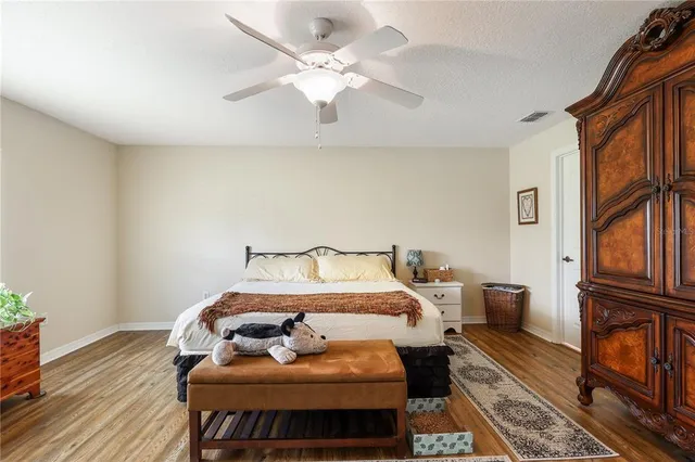 a bed room with a bed couch and a window