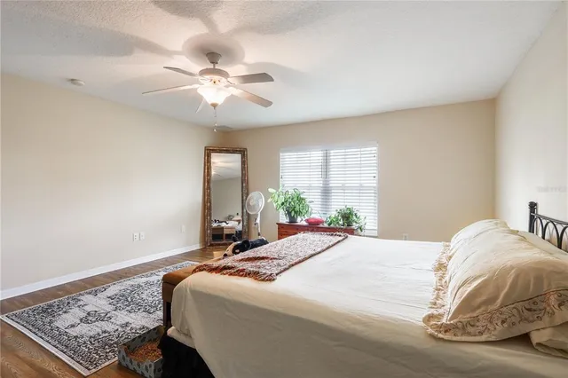 a view of bathroom with a sink toilet mirror and bathtub