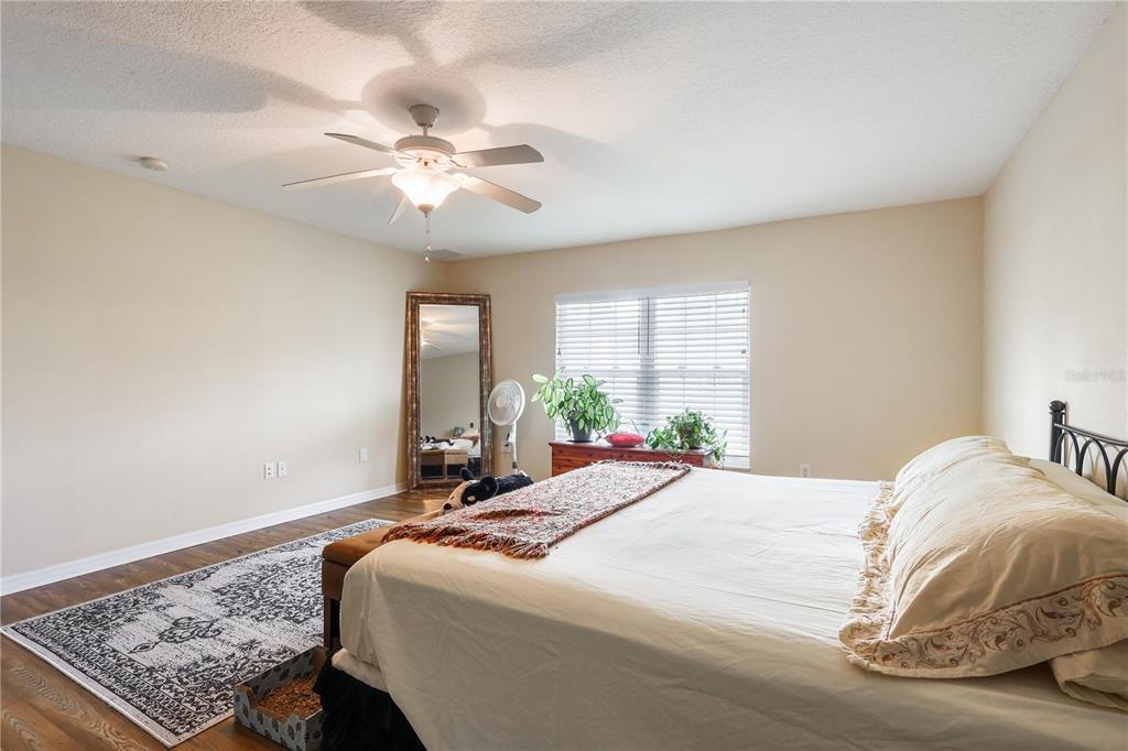 7290 Northeast 106 Terrace Bronson, FL 32621 - Photo 33 of 40 a bedroom with a bed and window