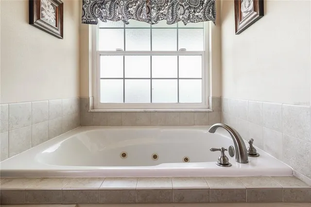 a bathroom with a toilet sink and tub