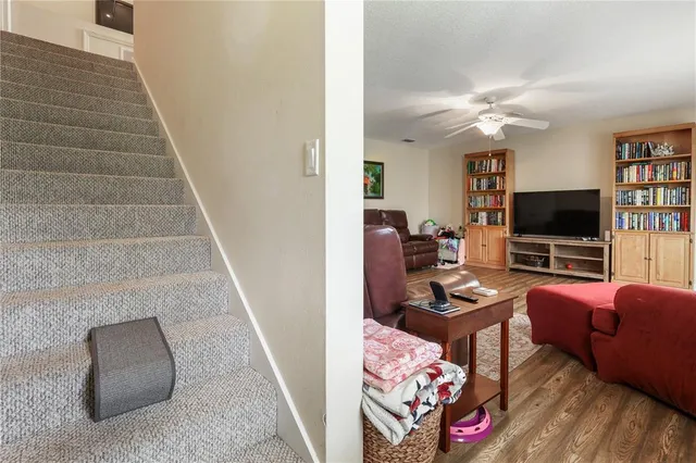 a living room with furniture and white walls