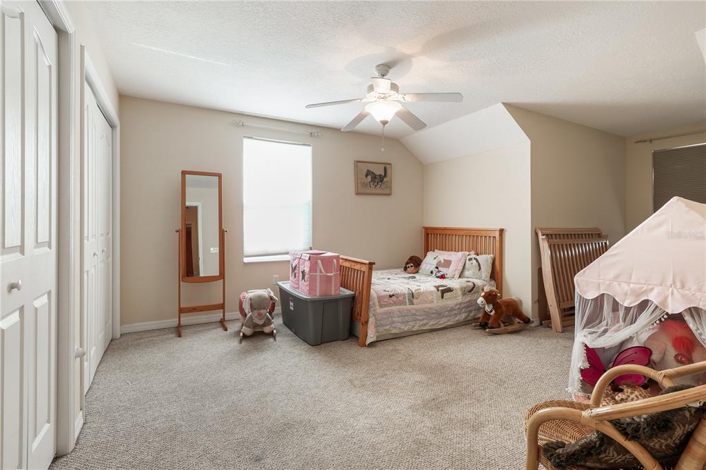 7290 Northeast 106 Terrace Bronson, FL 32621 - Photo 39 of 40 a living room with furniture and white walls
