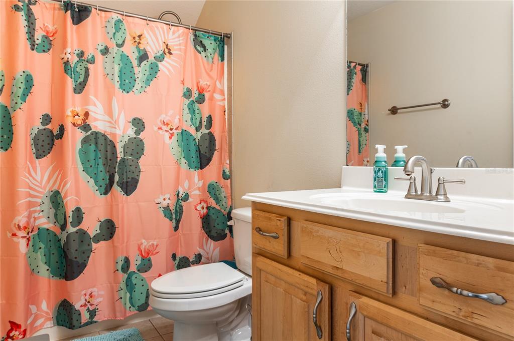 7290 Northeast 106 Terrace Bronson, FL 32621 - Photo 10 of 40 a bathroom with a toilet sink and mirror