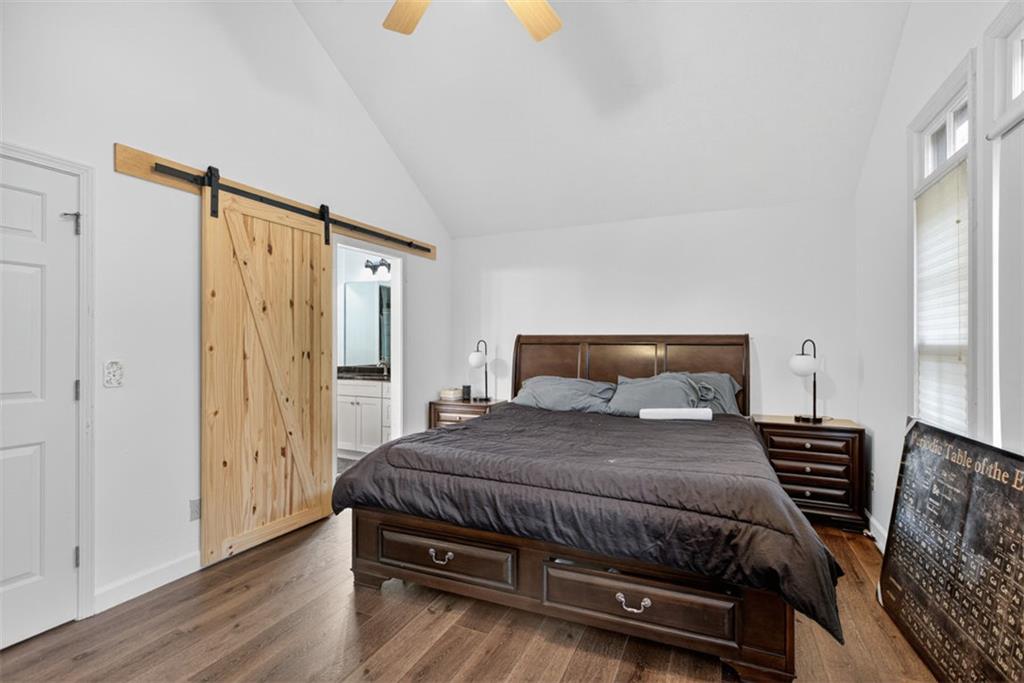 2222 Amber Creek Trail Buford, GA 30519 - Photo 11 of 51 a bedroom with a bed a dresser and a window