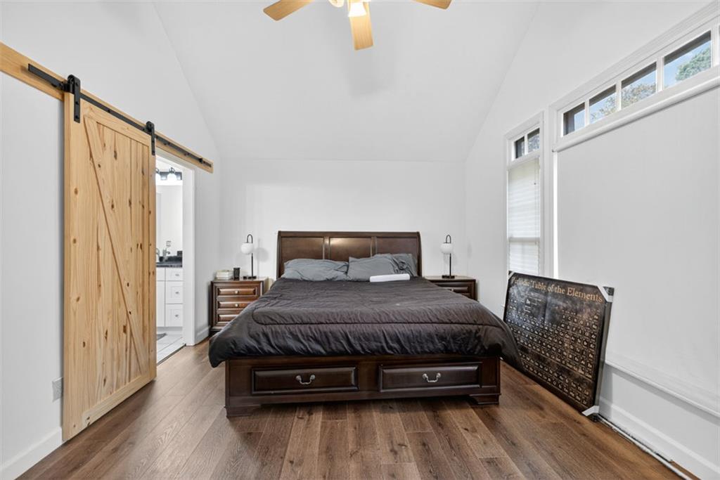 2222 Amber Creek Trail Buford, GA 30519 - Photo 12 of 51 a bedroom with a bed and wooden floor