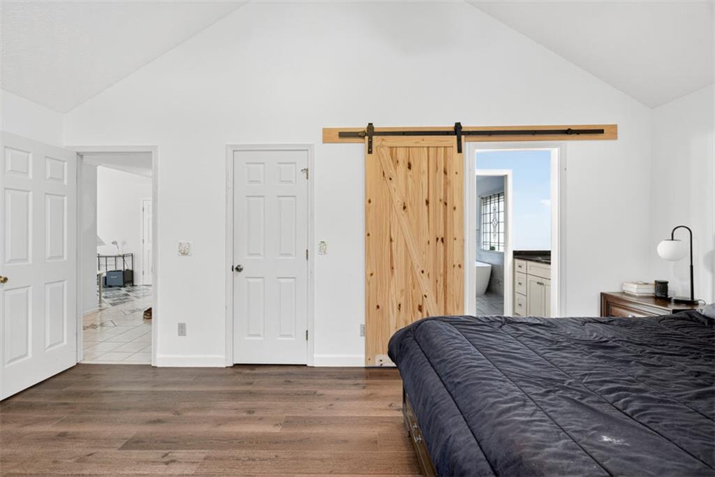 2222 Amber Creek Trail Buford, GA 30519 - Photo 13 of 51 a bedroom with a bed and cabinets