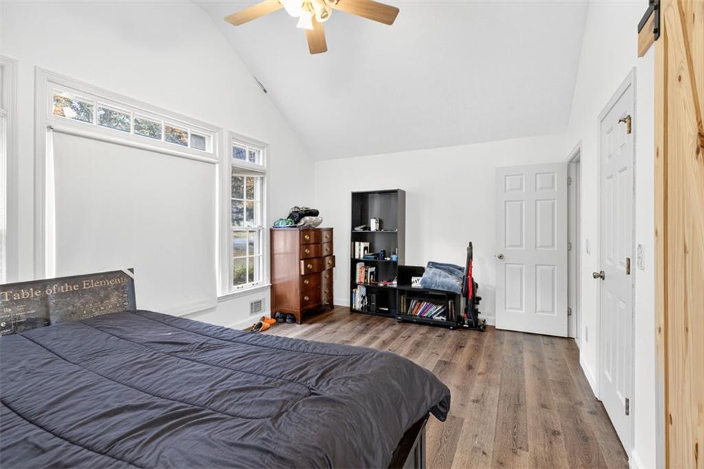 2222 Amber Creek Trail Buford, GA 30519 - Photo 14 of 51 a bedroom with a bed and a mirror