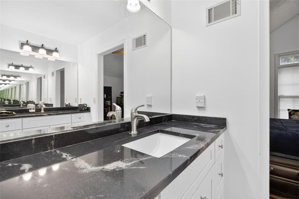2222 Amber Creek Trail Buford, GA 30519 - Photo 15 of 51 a kitchen with a sink stove and cabinets
