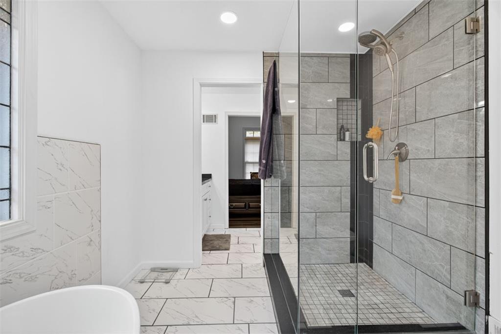 2222 Amber Creek Trail Buford, GA 30519 - Photo 18 of 51 a bathroom with a shower and toilet